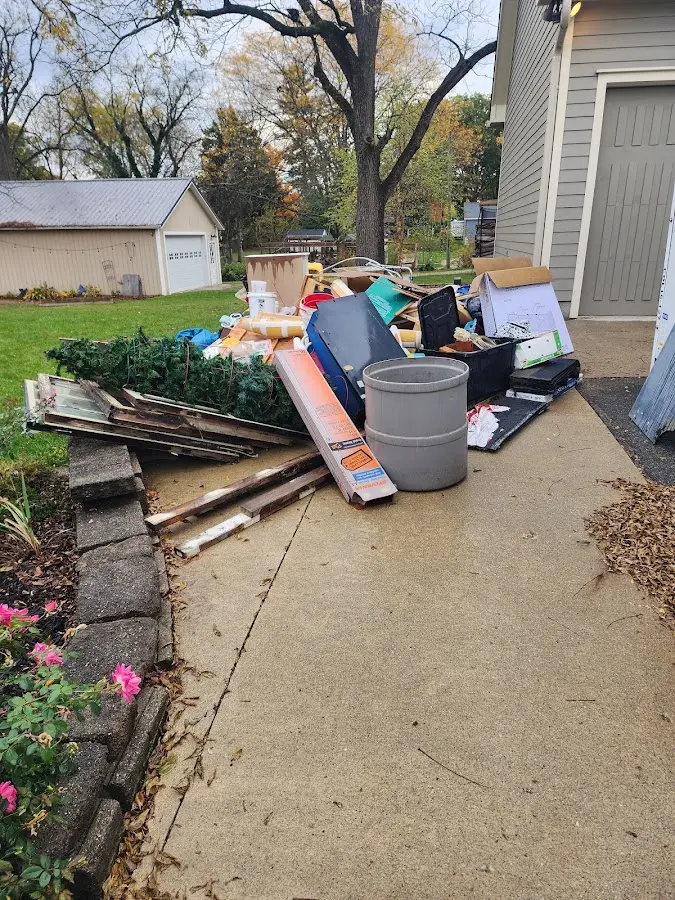 Dumpster being loaded with debris for 30 Yard Dumpster Rental in Hamilton